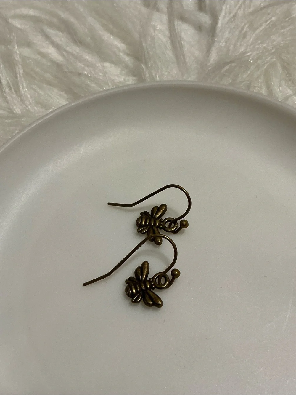 Tiny bronze bee dangle earrings